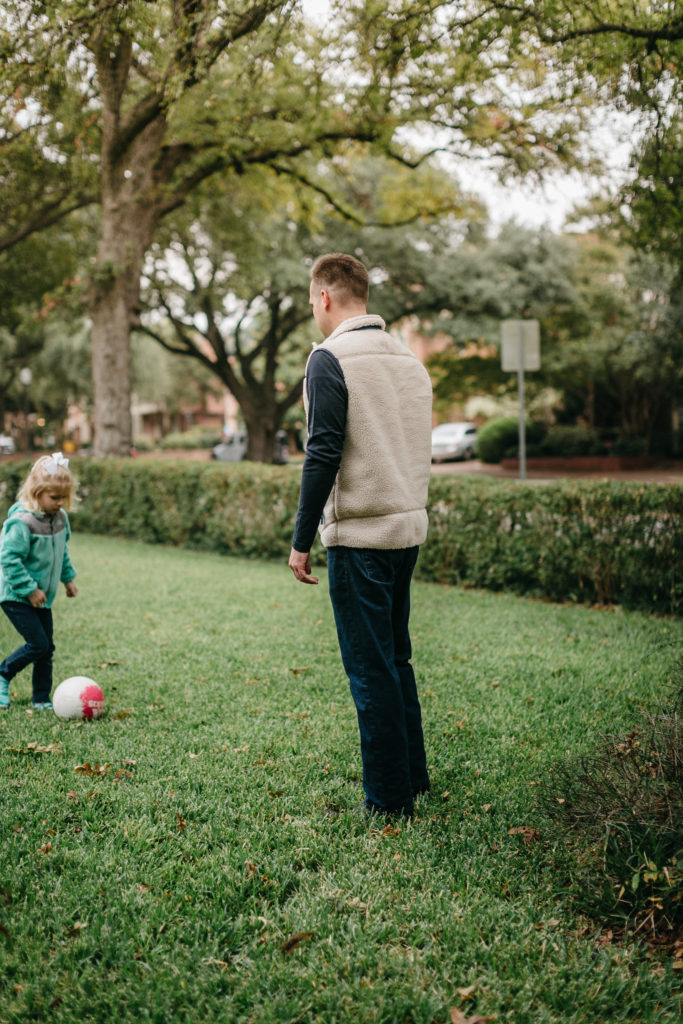 dad and daughter playing soccer